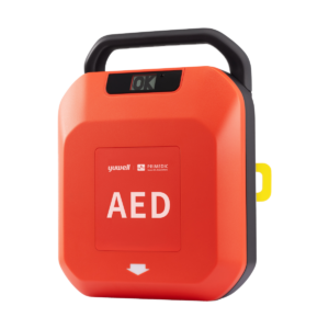 PRIMEDIC HeartSave Y półautomatyczny defibrylator AED z otwartą pokrywą i widoczną miniapteczką